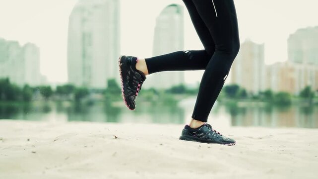 Runner Sprinting On Sand At Riverbank. Athlete Jogging On Beach. Cardio Workout And Fitness Training Outdoors