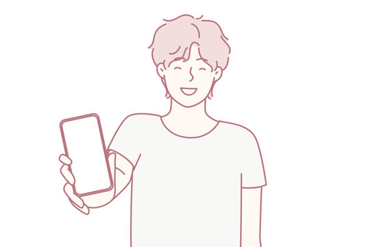Happy man showing smartphone screen and smiling to recommend cool applications. Positive college age guy holding mobile phone with blank display boasts website. Flat vector illustration
