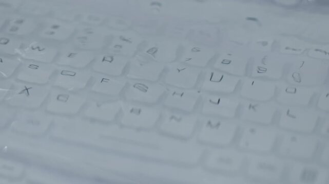 Close up of waterproof computer keyboard submerged under water in futuristic technology environment. Concept of durable electronics, cyber security and advanced digital protection systems.