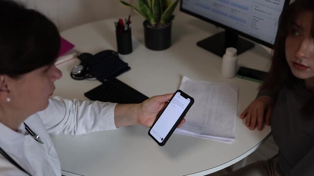 Doctor unsure about correct treatment consults artificial intelligence for modern medical recommendations and advanced healthcare approaches during patient consultation