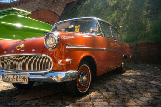 Berlin, Germany - May 2, 2026: Orange vintage Opel car at Oldtimer Open Air