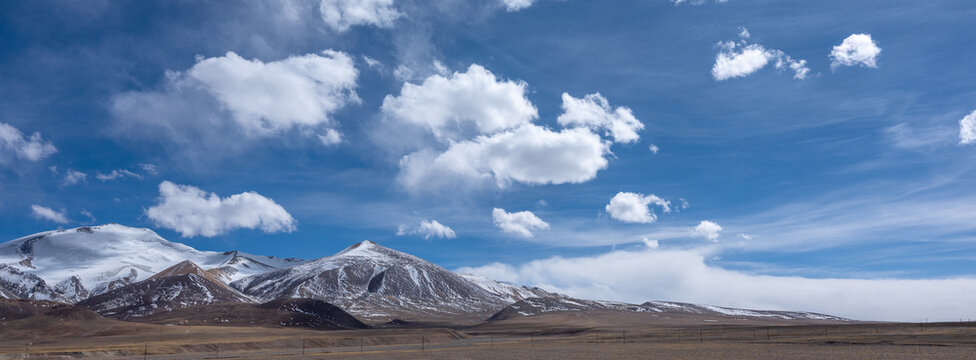 mountain landscape with clouds,Scenery of the uninhabited area of Tibet, blue sky and white clouds, plateau landforms, breathtaking scenery