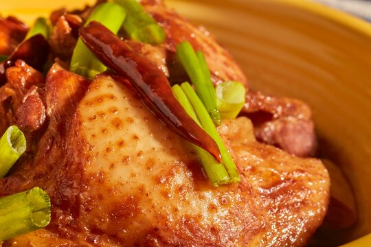 A bowl of three cups chicken, a popular dish in Chinese home cooking.