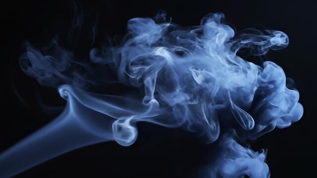 Ethereal blue vapor swirling gracefully across the somber, deep darkness, creating an atmospheric and captivating visual representation of ephemeral mist formation and wispy, intangible gaseous