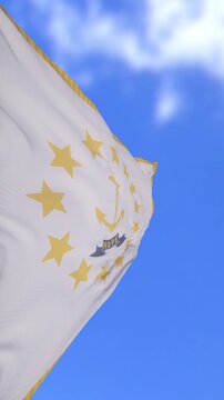 Rhode Island Flag Waving Against Bright Blue Sky