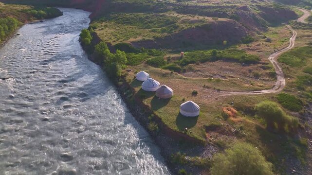 Aerial view of nomadic yurt camp at Naryn River confluence with two branches near Eki-Naryn, Kyrgyzstan