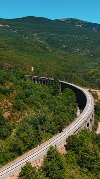 Scenic aerial view of canfranc railway viaduct in the spanish pyrenees mountains