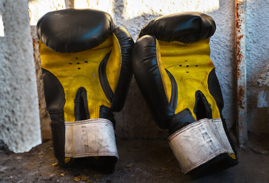 Worn boxing gloves in a nostalgic setting