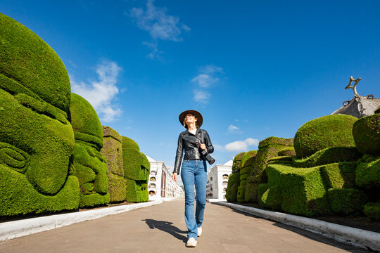 Tourist exploring Tulcan Cemetery in Ecuador