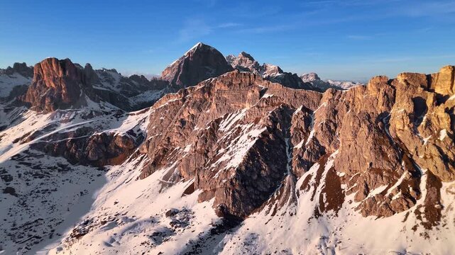 Aerial pan from Ra Gusela across Nuvolau and Averau with Tofana di Rozes behind, Dolomites