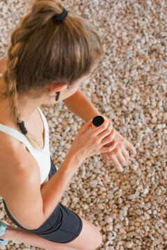 Focused athlete checking smart watch during outdoor workout