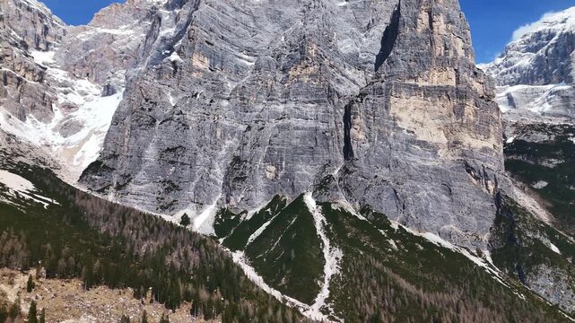 Aerial approach to massive north face of Civetta with Torre Trieste in foreground, Dolomites