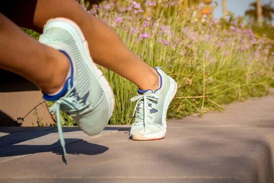 Close-up of runner shoes on pavement during outdoor training