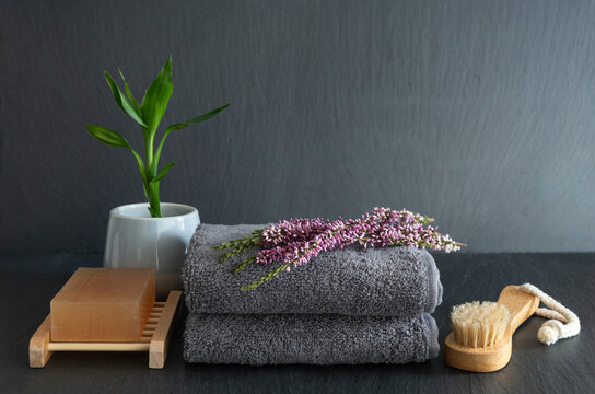 Spa still life with towel, soap, flower and essence scent