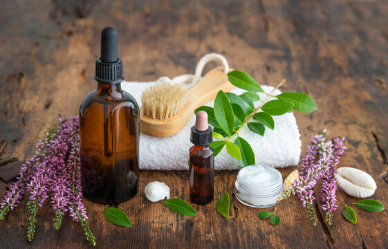 Natural spa skincare with essence oil, flower and towel