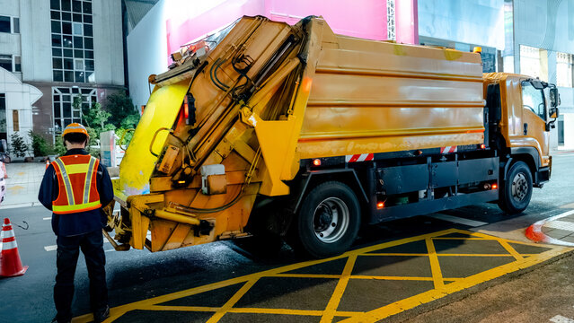Garbage truck operating at night in Taipei's Ximending