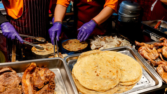 Delicious street food preparation at night market
