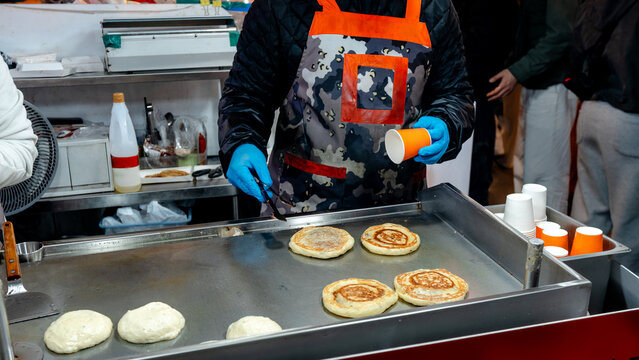 Hotteok street food cooking at Gwangjang Market, Seoul