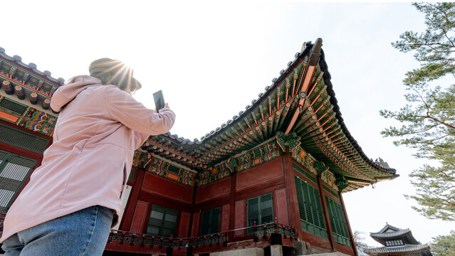 Tourist photographing Deoksugung Palace in Seoul