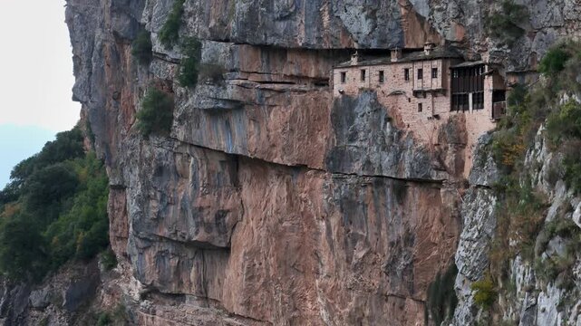 Medieval cliff monastery embedded in vertical rock face, Tzoumerka mountains, Epirus, Greece