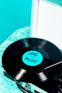 Retro vinyl record on turntable with love music label