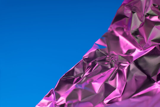 Abstract crumpled foil with vibrant color contrast