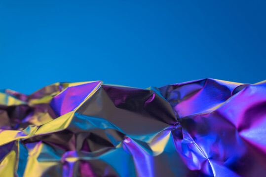 Abstract landscape of vibrant metallic waves