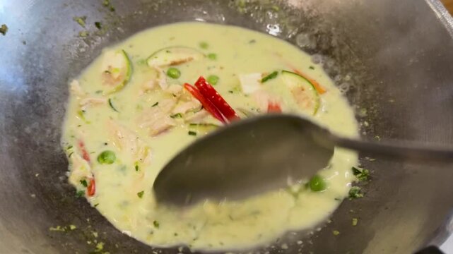 Closeup of Cooking Thai Green Curry with Chicken