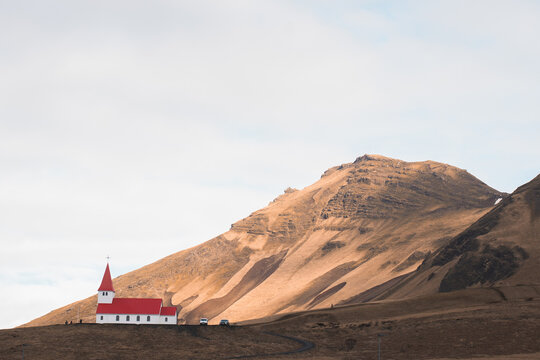 Icelandic church under mountain in remote countryside