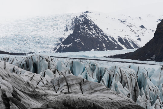 Svinafellsjokull glacier crevasses and snowy mountain, Iceland
