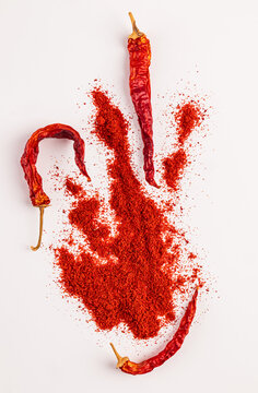 Red chili powder with dried pepper on white background