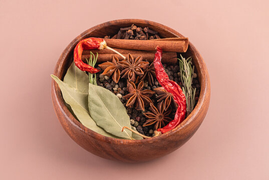 Aromatic spice bowl with chili, bay leaf, and star anise