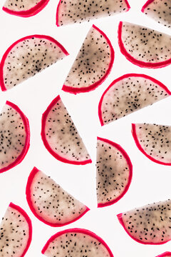 Dragon fruit slices pattern on white background, top view