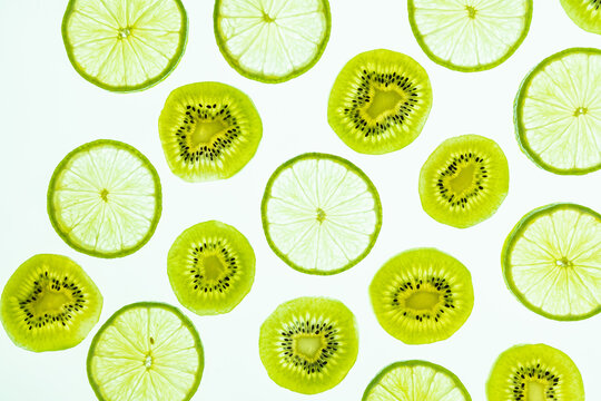 Fresh lime and kiwi slices pattern on white background