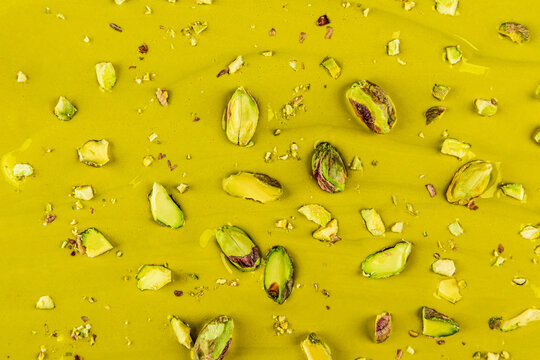 Pistachio mousse dessert texture with chopped nut topping