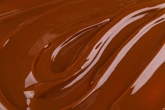 Smooth chocolate mousse swirl background for dessert