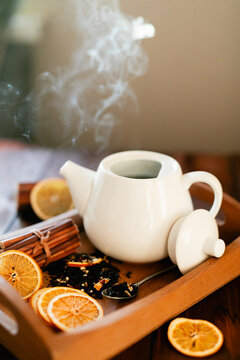 Steaming herbal tea with citrus and spice for relaxation