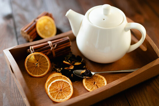 Herbal tea ingredients with teapot for relaxation and wellbeing