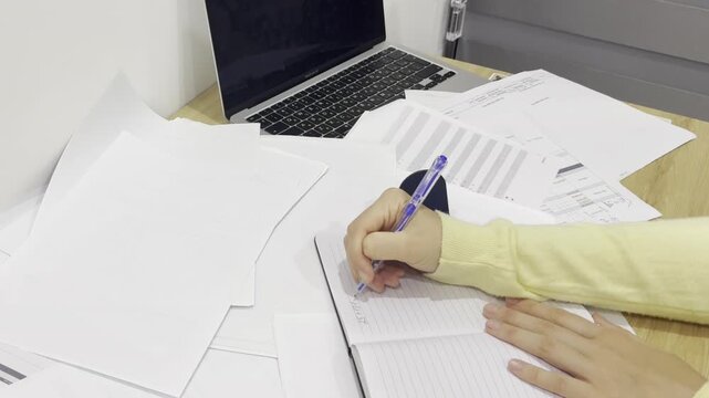 Video of paperwork and documents on a computer desk. Office workspace scene representing business routine, administration, productivity and desk organization.
