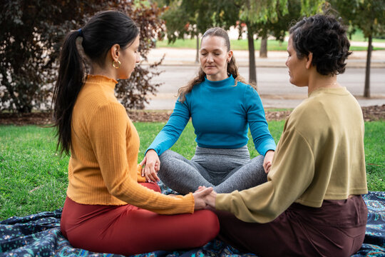 Meditation circle in park during a spiritual retreat