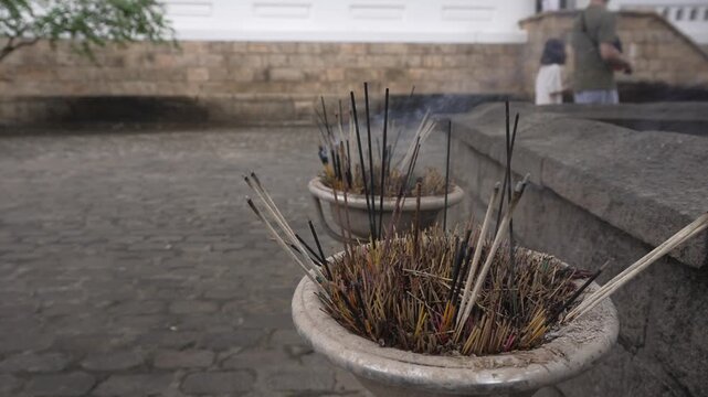 View of intense sticks, bathi or bathi pusa at Temple of Gold, Ran Giri (Golden Rock), Central Province, Matale District, Dambulla, Sri Lanka, Asia