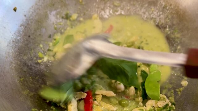 Closeup of Cooking Thai Green Curry with Chicken