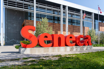 Fototapeta premium Toronto, Canada -May 18, 2026: Close up of Seneca sign at Seneca Polytechnic Newnham Campus in Toronto, Canada, in 2026. Seneca College of Applied Arts and Technology, branded as Seneca Polytechnic is