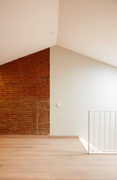 Minimal loft interior with brick wall and bright space