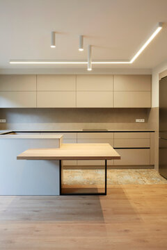 Minimal modern kitchen interior with island and LED light