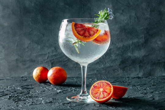 Refreshing summer Gin and Tonic with orange garnish