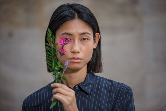 Portrait with flowers casting delicate shadows