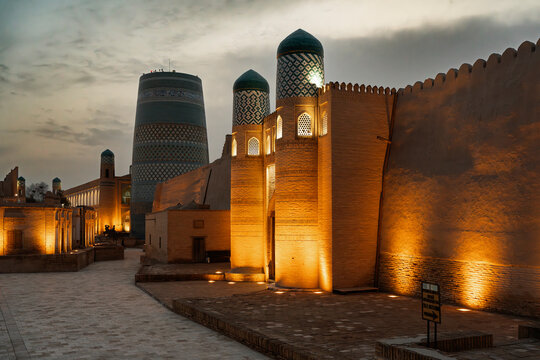 Ancient Hiva city wall and minaret at dusk, Uzbekistan