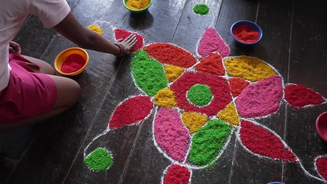 View of tourists performing the Hindu family art of Kolam, drawings made of coloured rice, Nuwara Eliya, Central Province, Sri Lanka, Asia