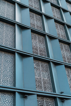 Intricate geometric patterns on modern architectural facade